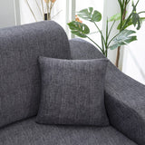 Housse de coussin gris chine sur canape