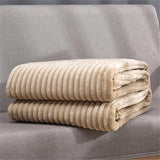 Plaid beige canape