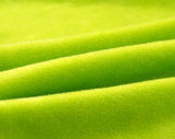 Tissu elastique et doux de notre housse de canape en velours vert