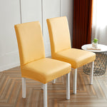 Housses de chaises extensibles simili cuir jaune