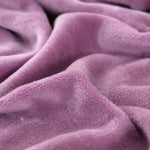 Textile doux de notre housse de canape d'angle en velours mauve