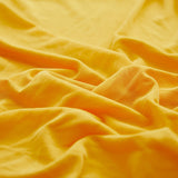Textile elastique pour housse assise de canape jaune moutarde