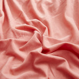 Textile elastique pour housse assise de canape rose corail