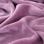 Tissu elastique et doux de notre housse de canape velours mauve