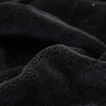 Tissu elastique et doux de notre housse de canape en velours noir