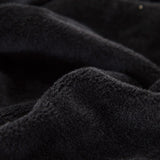 Tissu elastique et doux de notre housse de canape en velours noir