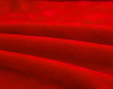 Tissu elastique et doux de notre housse de canape en velours rouge