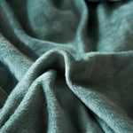 Tissu elastique et doux de notre housse de canape velours vert d'eau