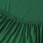 Tissu elastique pour housse de canape angle vert fonce